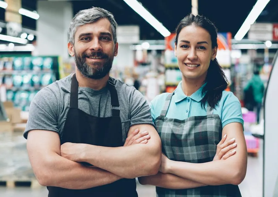 Two small business owners standing in their shop